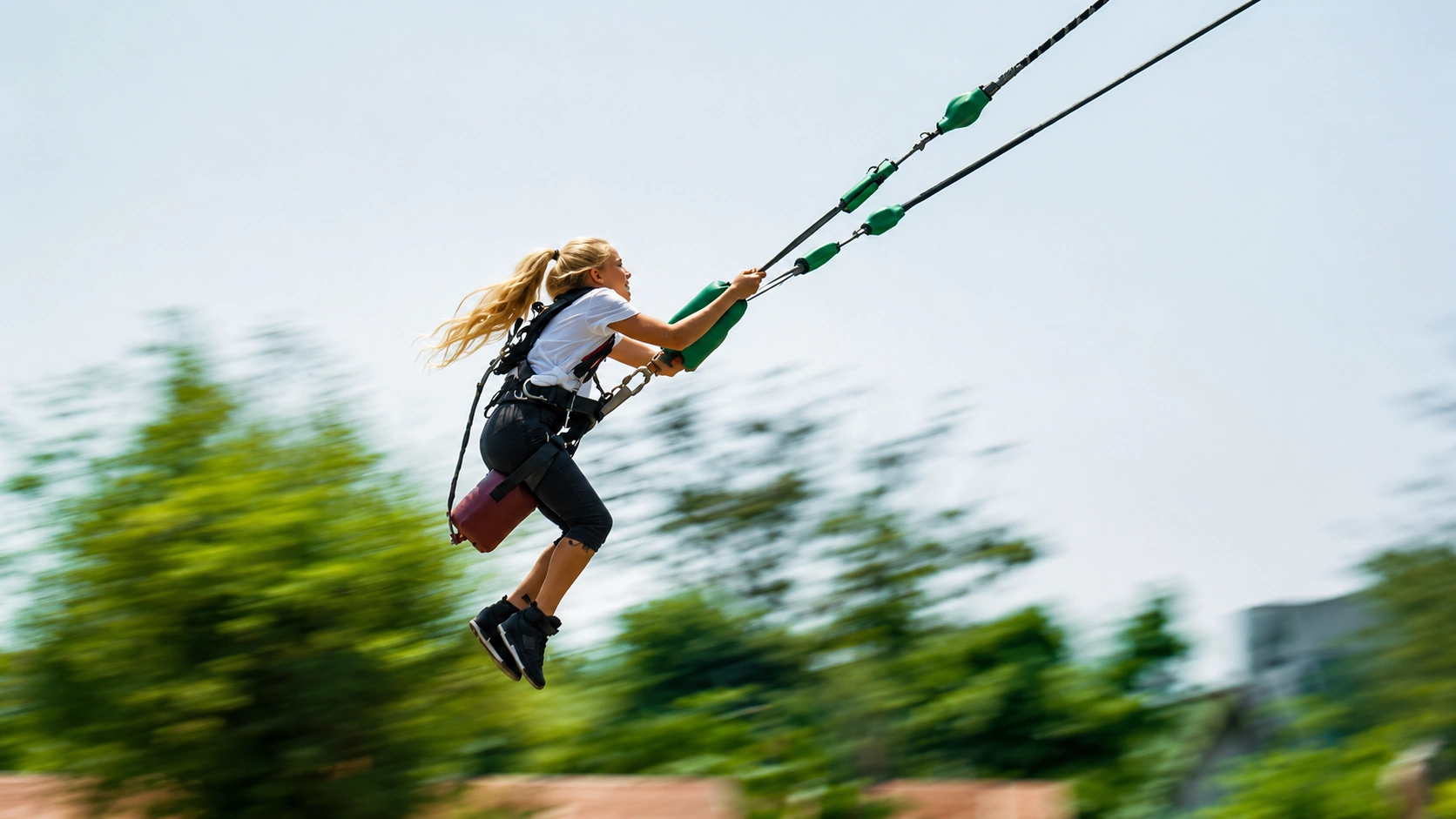 A girl is catapulted on a human slingshot